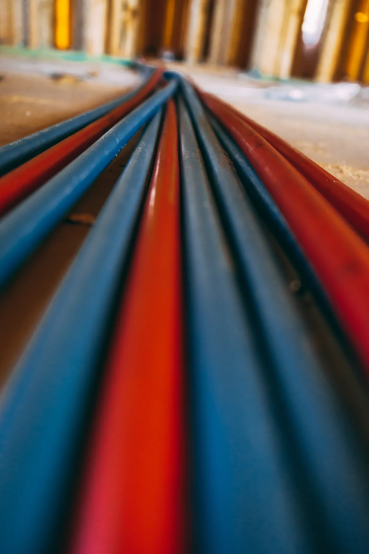 Coiled red and blue PEX tubing ready for a repipe – Costa Mesa Rinnai Tankless Water Heater Installation for Costa Mesa, CA homes